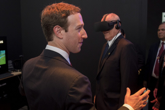 epa05765798 (FILE) - A file picture dated 19 November 2016 shows founder and CEO of Facebook Mark Zuckerberg (L) observing Peruvian President Pedro Pablo Kuczynski (R) who tries a virtual reality headset at the stand of Facebook, during an event in the frame of the Asia Pacific Economic Cooperation Forum (APEC) in Lima, Peru. According to media reports on 02 February 2017, Facebook lost a 500 million US dollar lawsuit to Zenimax, over copyright issues on the computer code used by Oculus VR, which was bought by Facebook in 2014.  EPA/PABLO PORCIUNCULA / POOL